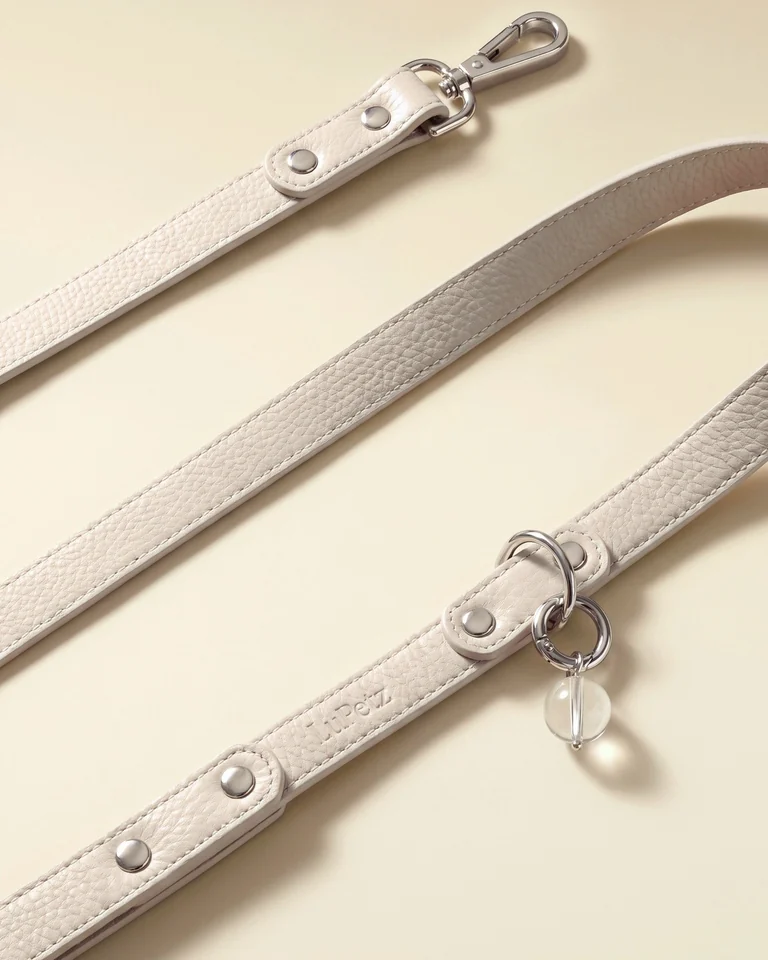 Taupe leather LuKra leash with the pressed LuPetz mark and a clear quartz bead